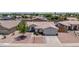 Charming single-story home with well-manicured landscaping and a spacious two-car garage at 15019 W Banff Ln, Surprise, AZ 85379