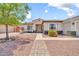 Charming single-story home with a well-maintained yard, walkway, and inviting curb appeal at 15019 W Banff Ln, Surprise, AZ 85379