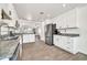 Bright open kitchen with stainless steel appliances and granite countertops at 15019 W Banff Ln, Surprise, AZ 85379