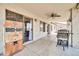 Covered patio featuring a ceiling fan, exterior lights, and vintage 7-Up vending machine at 15019 W Banff Ln, Surprise, AZ 85379