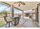 Charming covered patio area with a ceiling fan and ample space for outdoor dining and relaxation at 15019 W Banff Ln, Surprise, AZ 85379