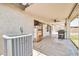 Covered patio featuring textured walls, ceiling fan and vintage soda machine accentuating the space at 15019 W Banff Ln, Surprise, AZ 85379