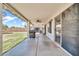 Inviting covered patio with stylish outdoor seating and access to a lush green backyard at 15019 W Banff Ln, Surprise, AZ 85379