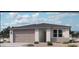 Beautiful single-story home featuring neutral colors, a two-car garage and a low maintenance desert landscape at 15793 W Beryl Ave, Waddell, AZ 85355