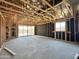 Unfinished home interior featuring wood framing, sliding glass doors, and views to the outside at 15793 W Beryl Ave, Waddell, AZ 85355