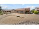 Wide shot of expansive backyard with desert landscaping at 16222 W Silver Falls Dr, Surprise, AZ 85374