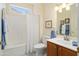 Clean bathroom with shower-tub combo, updated vanity, and neutral wall color at 16222 W Silver Falls Dr, Surprise, AZ 85374