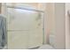 Bathroom featuring shower with glass door, toilet, and neutral wall color at 16222 W Silver Falls Dr, Surprise, AZ 85374