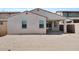 View of the home's backyard featuring stucco walls and an inviting covered patio at 16784 W Hope Dr, Surprise, AZ 85388