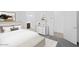 Well-lit bedroom with a serene ambiance, featuring a comfortable bed, soft carpet, and tasteful decor at 16784 W Hope Dr, Surprise, AZ 85388