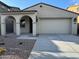 Charming single-story home with a two-car garage and stucco exterior, offering a welcoming curb appeal at 16784 W Hope Dr, Surprise, AZ 85388