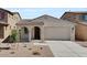 Charming single-story home features a tile roof, stucco facade, and a two-car garage at 16784 W Hope Dr, Surprise, AZ 85388