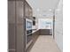 Contemporary kitchen showcases stainless appliances, ample cabinet space, and an open layout at 16784 W Hope Dr, Surprise, AZ 85388