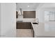 Bright kitchen features white counters, a stainless sink, and stainless appliances at 16784 W Hope Dr, Surprise, AZ 85388