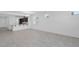 Spacious living room features neutral paint, tiled floors, and an open floor plan at 16784 W Hope Dr, Surprise, AZ 85388