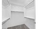 Spacious walk-in closet with ample shelving and rods, providing optimal organization and storage solutions at 16784 W Hope Dr, Surprise, AZ 85388