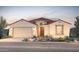 Charming single-story home featuring a stucco facade, red tile roof, and a well-manicured desert landscape at 17636 W Pasadena Ave, Litchfield Park, AZ 85340