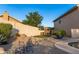 Spacious backyard with an artificial turf area, desert landscaping, and a sparkling pool, perfect for outdoor relaxation at 19276 N 90Th Pl, Scottsdale, AZ 85255