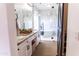 Elegant bathroom showcasing a dual sink vanity, glass-enclosed shower, and contemporary soaking tub at 19276 N 90Th Pl, Scottsdale, AZ 85255