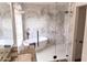 Luxurious bathroom featuring a freestanding tub, marble tiling, and an elegant glass shower at 19276 N 90Th Pl, Scottsdale, AZ 85255