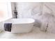 Bright and modern bathroom featuring a freestanding tub, sleek fixtures, and designer tile work at 19276 N 90Th Pl, Scottsdale, AZ 85255