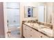 Well-lit bathroom featuring a dual-sink vanity with granite countertops and a shower-tub combination at 19276 N 90Th Pl, Scottsdale, AZ 85255