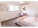 Cozy bedroom featuring modern decor, natural light, and inviting furnishings at 19276 N 90Th Pl, Scottsdale, AZ 85255