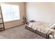 Cozy bedroom with large window, providing natural light and a simple, minimalist aesthetic at 19276 N 90Th Pl, Scottsdale, AZ 85255