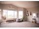 Bright bedroom with unique layout, featuring a hammock chair, window seating, and decorative elements at 19276 N 90Th Pl, Scottsdale, AZ 85255