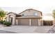 A charming two-story home showcases a spacious three-car garage and well-maintained landscaping at 19276 N 90Th Pl, Scottsdale, AZ 85255