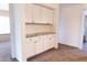 Bright hallway with built-in cabinets and countertop space, providing storage and functionality at 19276 N 90Th Pl, Scottsdale, AZ 85255