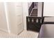 Hallway featuring a wooden safety gate and a view of the carpeted stairs at 19276 N 90Th Pl, Scottsdale, AZ 85255