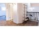Hallway featuring an open staircase with modern shelving, offering a glimpse into adjacent rooms at 19276 N 90Th Pl, Scottsdale, AZ 85255