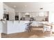 Spacious kitchen with white cabinetry, granite counters, breakfast bar, and stainless appliances at 19276 N 90Th Pl, Scottsdale, AZ 85255