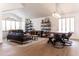 Open-concept living room with vaulted ceilings, stylish furnishings, and ample natural light at 19276 N 90Th Pl, Scottsdale, AZ 85255