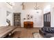 Bright entryway with high ceilings, a piano, decor cabinet, and direct access to the stairs at 19276 N 90Th Pl, Scottsdale, AZ 85255