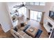 Open floor plan showcases living room, dining area, and kitchen with natural light and modern furnishings at 19276 N 90Th Pl, Scottsdale, AZ 85255