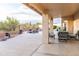 Covered patio with seating area overlooking the pool and backyard at 19276 N 90Th Pl, Scottsdale, AZ 85255