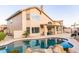 Backyard oasis featuring a pool, covered patio, and well-maintained landscaping for outdoor enjoyment at 19276 N 90Th Pl, Scottsdale, AZ 85255