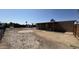 Large backyard features a shed, covered patio and desert landscaping at 20626 N 35Th Ave, Glendale, AZ 85308