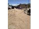 Large backyard features a dirt lot, playhouse, several vehicles, and chain-link fencing at 20626 N 35Th Ave, Glendale, AZ 85308