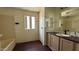 Bathroom with a walk-in shower, sink, window and mirror at 20626 N 35Th Ave, Glendale, AZ 85308