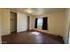 The bedroom features wood-look floors, a window, and a closet at 20626 N 35Th Ave, Glendale, AZ 85308