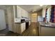 The kitchen features white cabinets, black appliances, and a view into the dining area at 20626 N 35Th Ave, Glendale, AZ 85308
