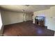 The spacious living room has wood flooring and is well-lit with a fish tank feature at 20626 N 35Th Ave, Glendale, AZ 85308