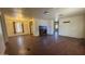 Open-concept living room has a view of the kitchen and dining area with natural light at 20626 N 35Th Ave, Glendale, AZ 85308