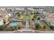 Aerial view of the park area featuring a pool, playground, and green spaces within the community at 2237 S Jacana Ln, Gilbert, AZ 85295