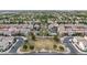 Wide aerial view showcasing the residential neighborhood featuring green spaces and amenities at 2237 S Jacana Ln, Gilbert, AZ 85295