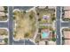 Aerial view of the community featuring a playground, pool, and lush green spaces at 2237 S Jacana Ln, Gilbert, AZ 85295