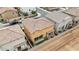 Aerial view of the backyard with a covered patio, artificial turf, and outdoor grill at 2237 S Jacana Ln, Gilbert, AZ 85295